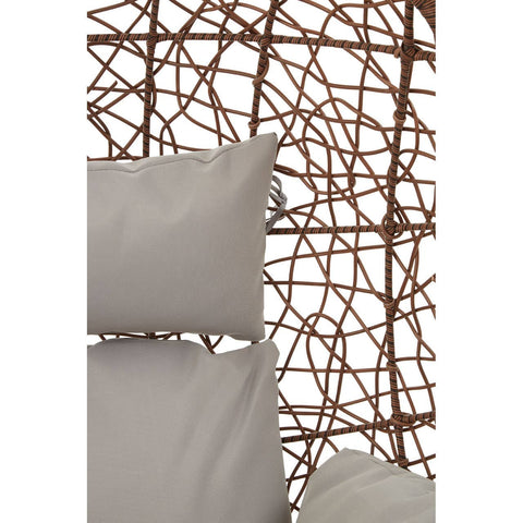Brown rattan hanging chair featuring a woven design with a textured backrest and two light-colored cushions for comfort. The chair is suspended, showcasing its unique structure and natural materials