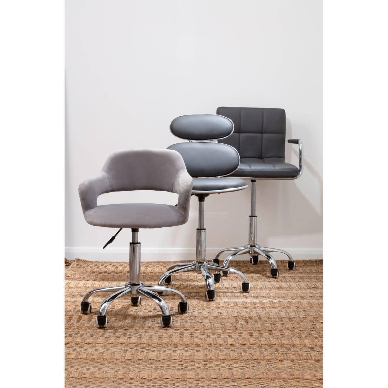 Three modern office chairs with chrome bases and grey upholstery on a woven rug