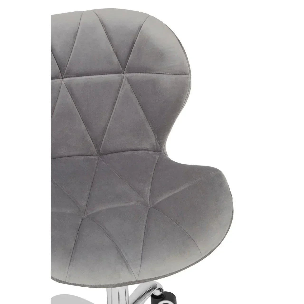 Grey velvet office chair with diamond-stitched backrest and chrome wheeled base detail
