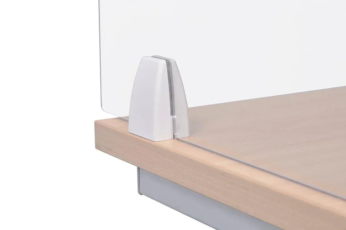 Glass desk divider panel with metal clamp mounted on light wood office desk
