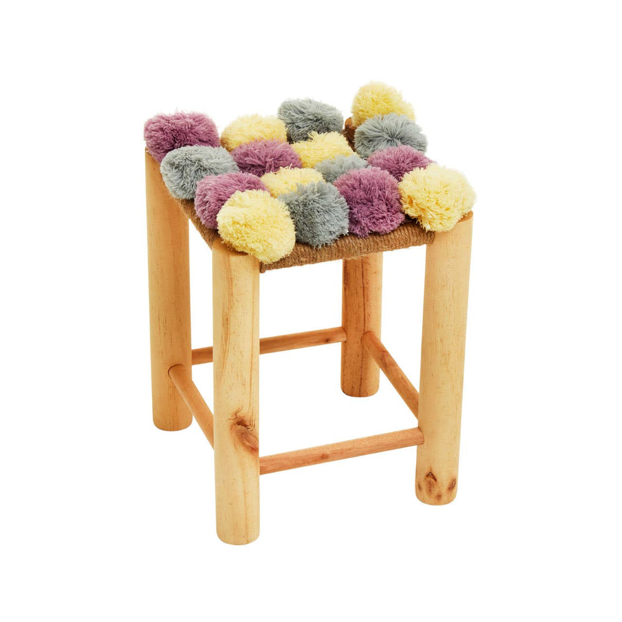 A small stool with a wooden frame featuring a top adorned with colorful pom poms in shades of grey, beige, pink, and yellow. The legs are light wood, providing a natural contrast to the vibrant pom poms