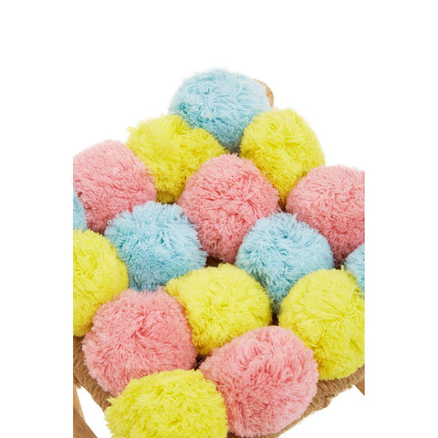 A colorful stool featuring a playful arrangement of pink, blue, and yellow pom poms on a neutral base, adding a whimsical touch to home decor