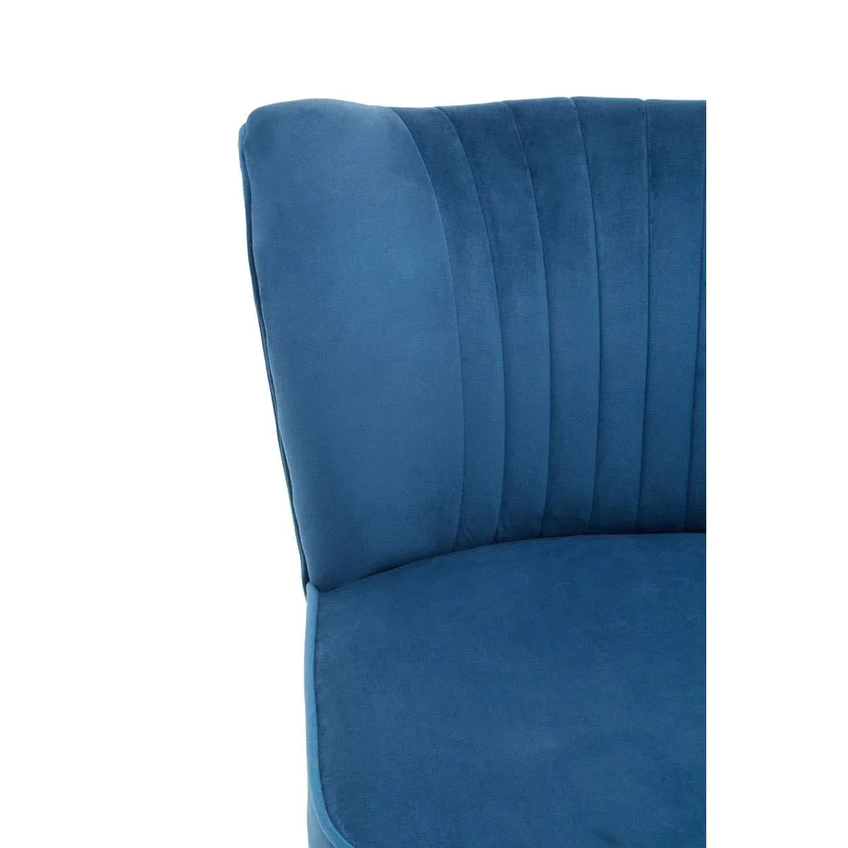Close view of blue velvet chair with curved backrest and vertical stitched detail