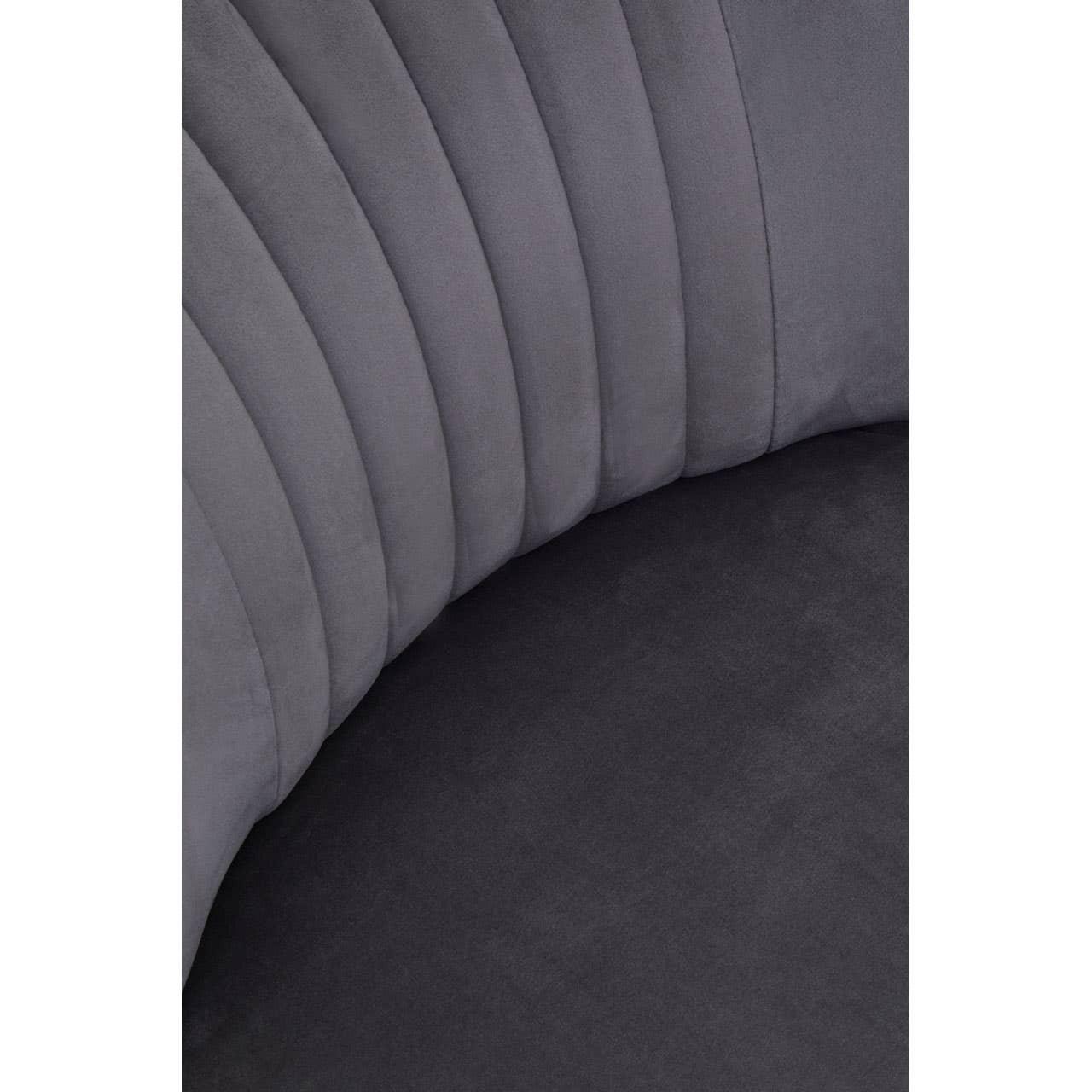 Closeup of grey velvet sofa upholstery with vertical channel stitching