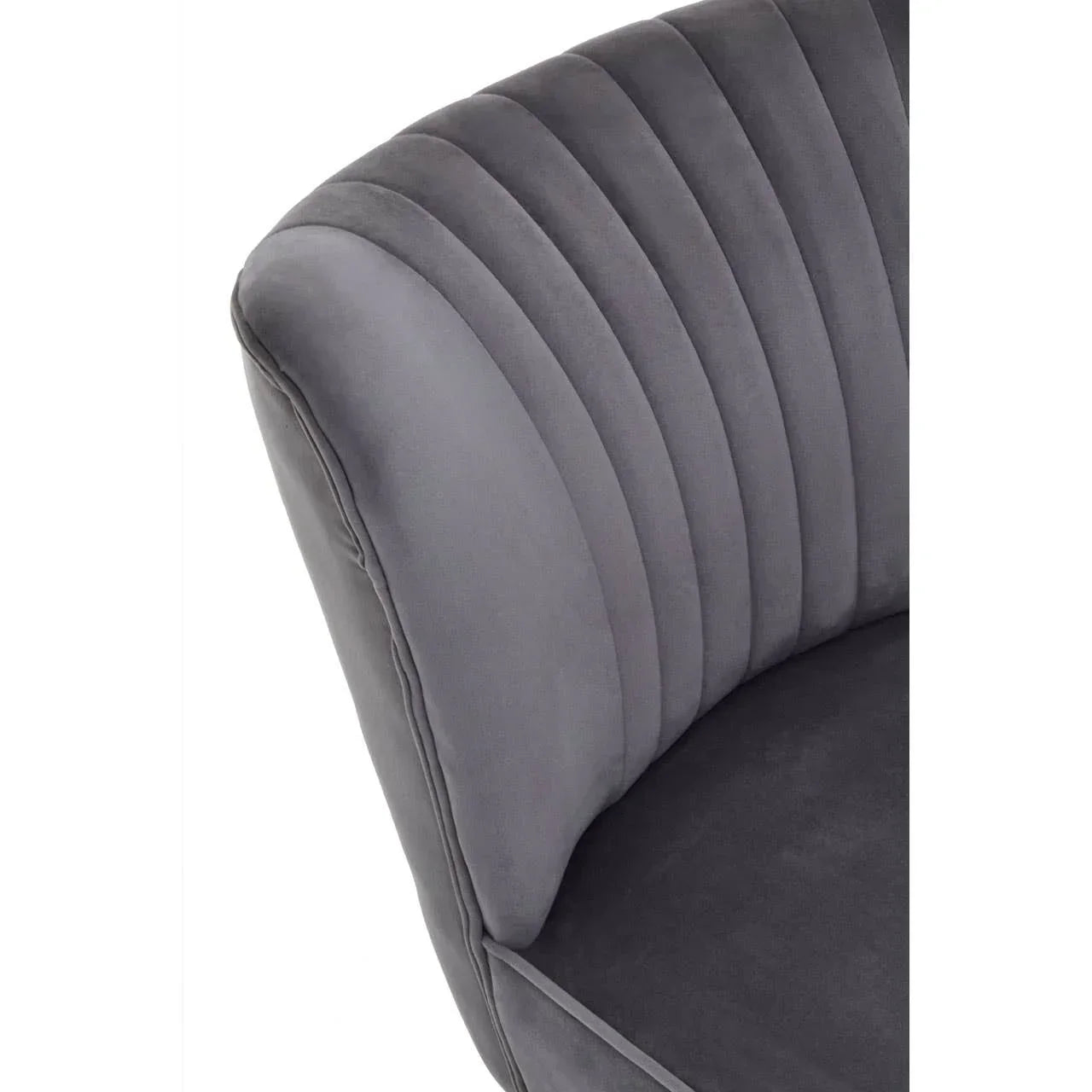 Close up of grey velvet armchair with vertical stitched backrest
