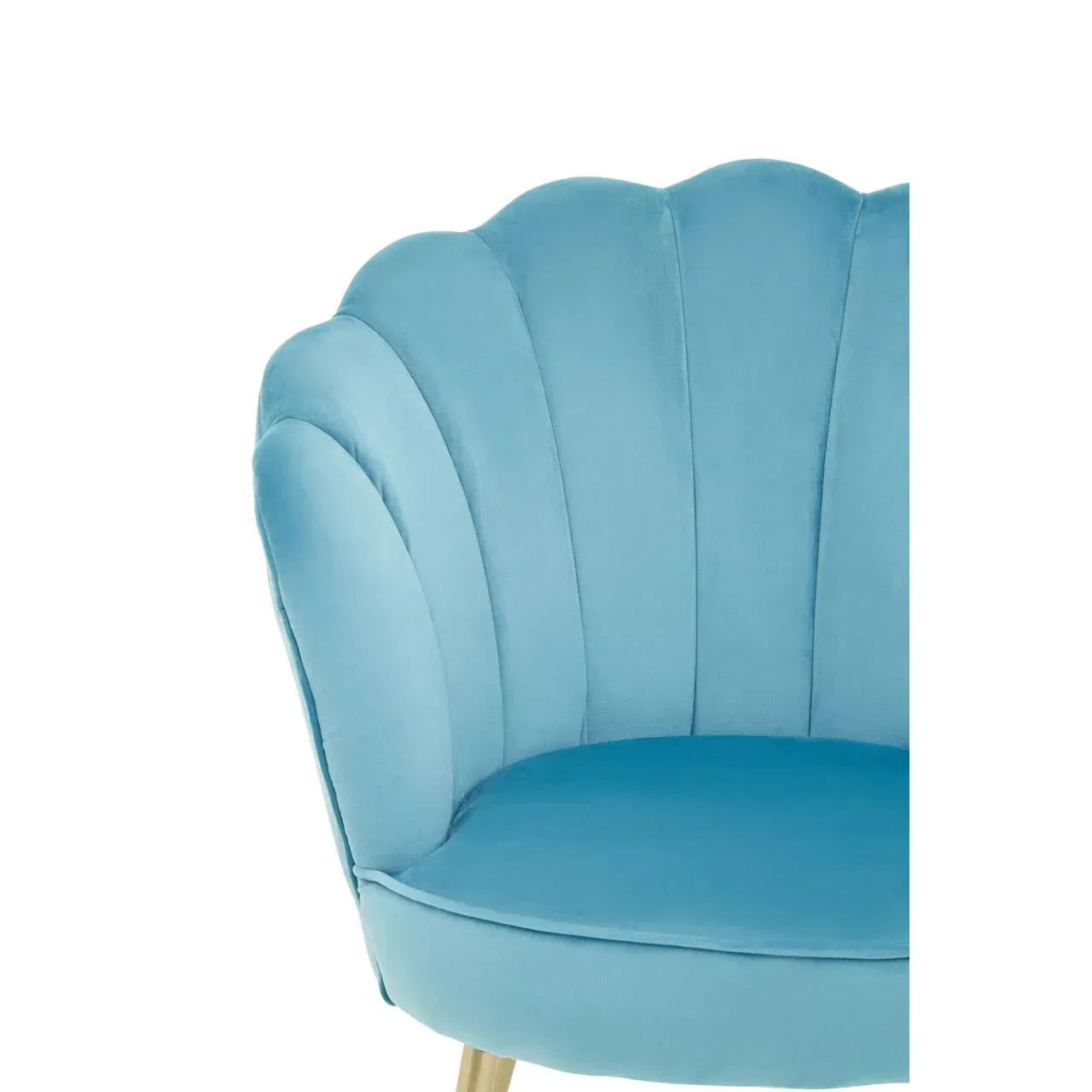 Blue velvet accent chair with scalloped backrest and light wooden legs, partial close-up