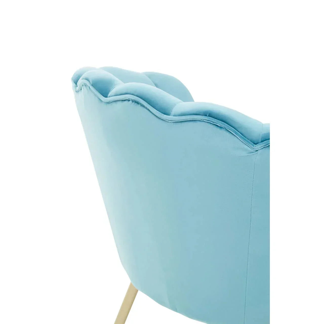 Closeup of light blue accent chair with scalloped velvet backrest and angled wooden leg