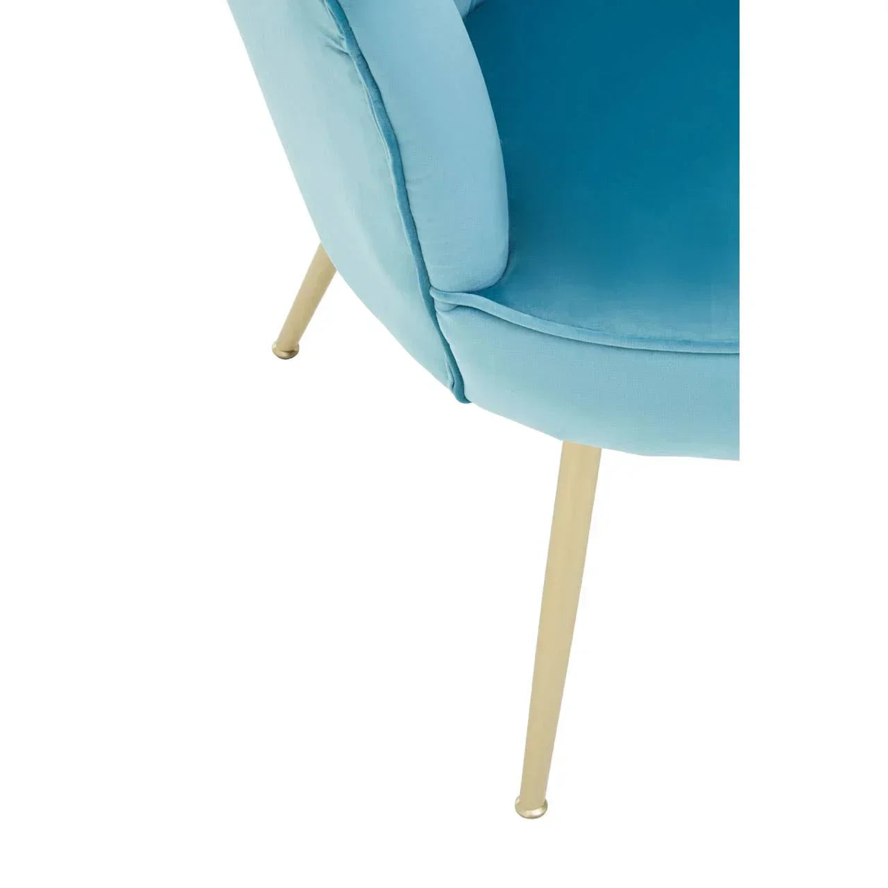 Detail of blue velvet accent chair with gold metal legs
