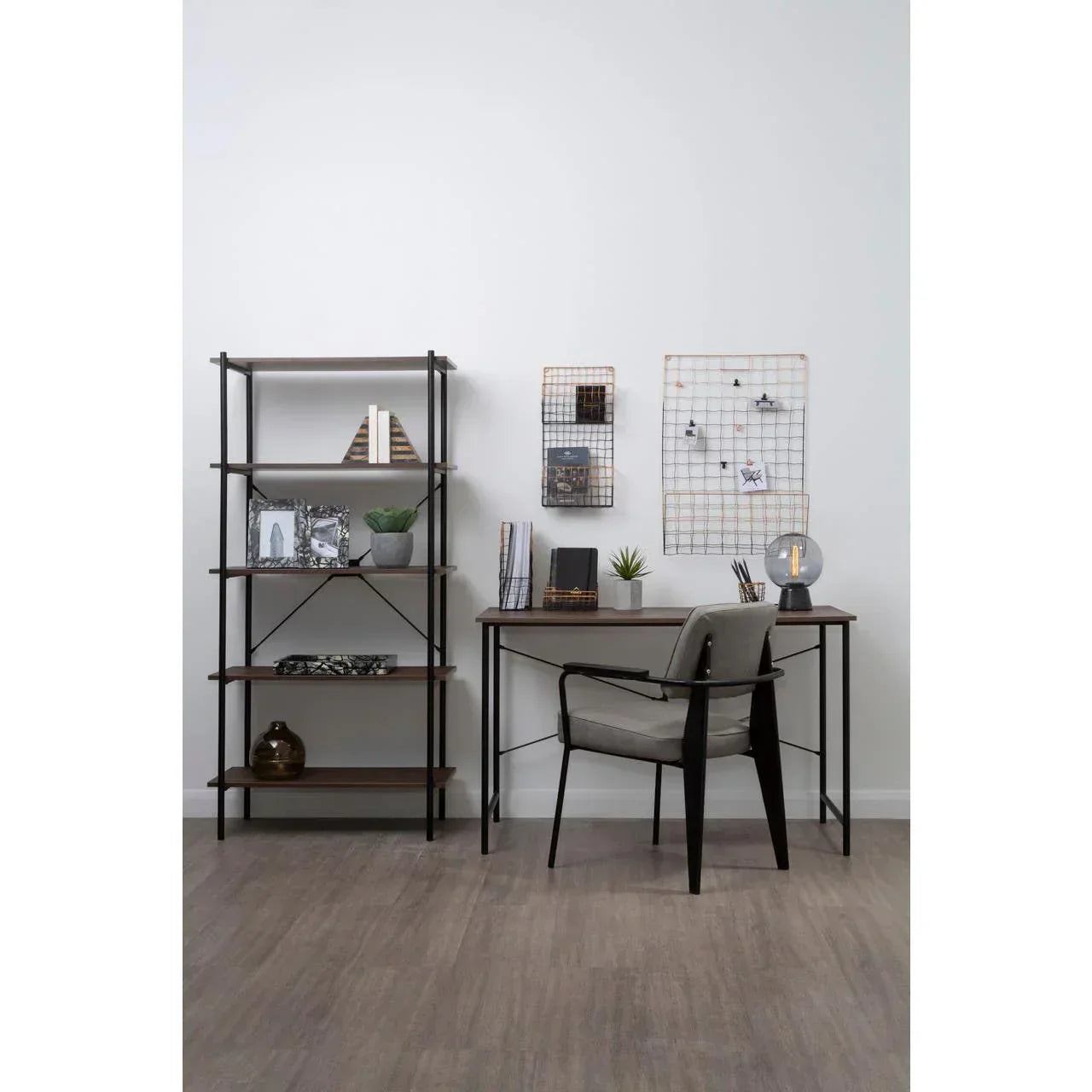 Walnut wood desk with metal legs and grey chair in modern home office setup