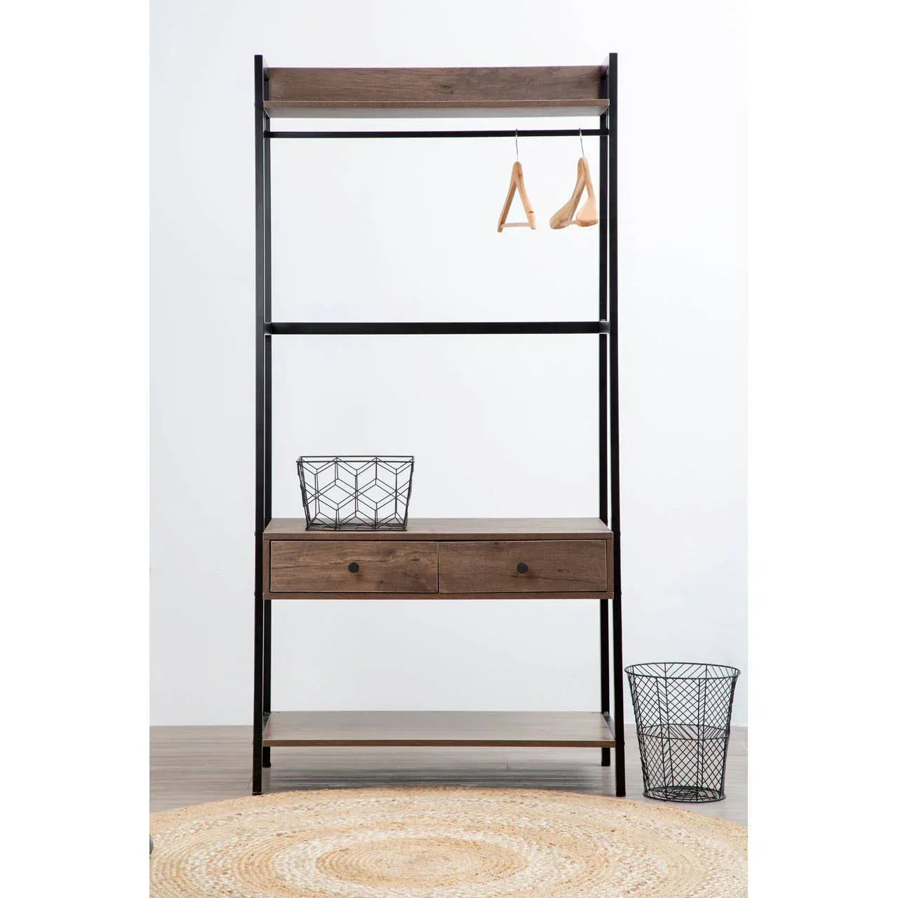 Industrial clothes rail with wooden shelves, two drawers, metal frame, and storage basket