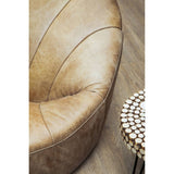 A close-up view of a round side table featuring a mosaic design made of fir wood, positioned next to a plush, tan-colored upholstered chair. The table showcases a circular top with intricate patterns, while the chair has a curved, inviting shape with visible stitching details. The background features light wooden flooring, enhancing the warm aesthetic of the scene