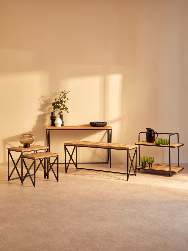 Industrial style furniture set with oak wood tops and black metal frames in living room