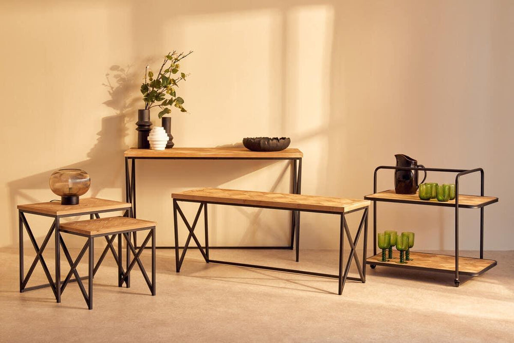 Industrial style furniture set with black metal frames and light wood tops, living room display