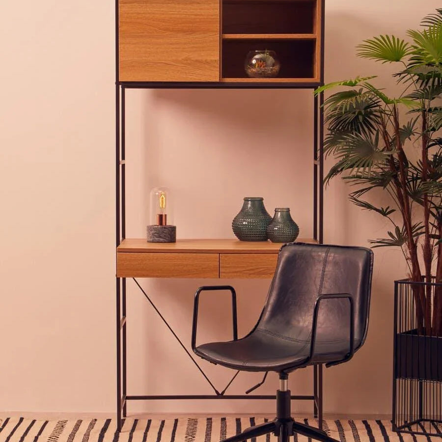 Modern home office desk with oak shelves and black swivel chair on striped rug