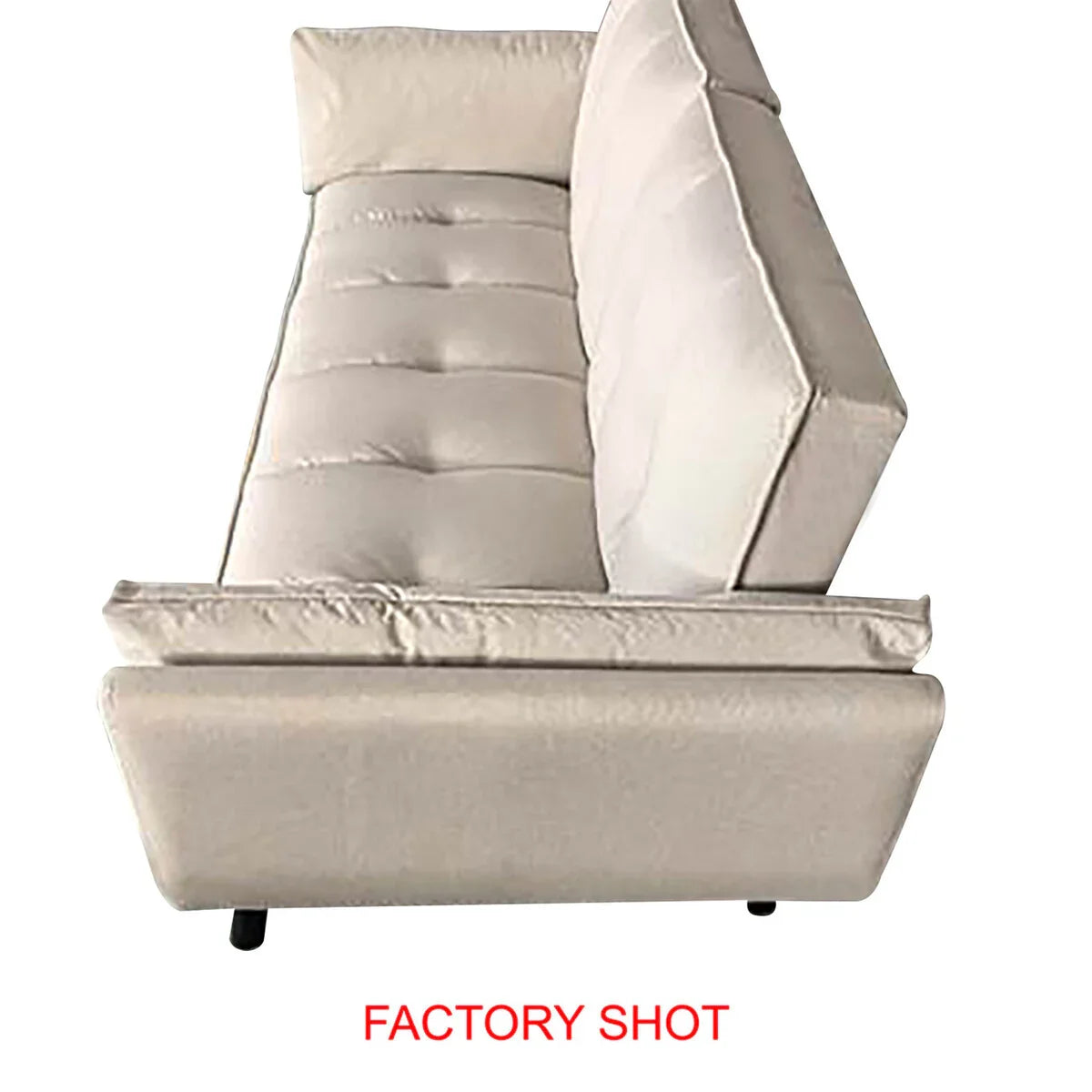 Beige fabric sofa with tufted seat and cushioned backrest, side angle factory shot