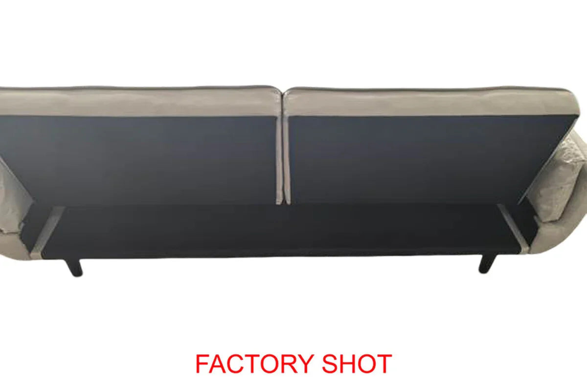 Rear view of beige fabric sofa with visible black support panel and slim legs