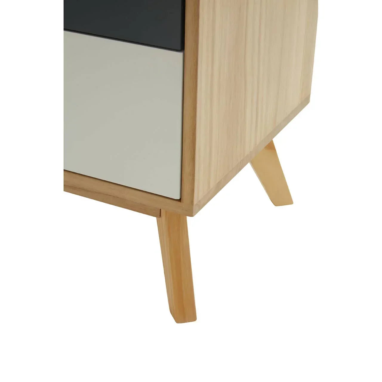 Close view of wooden furniture leg and two-tone drawer front in modern design