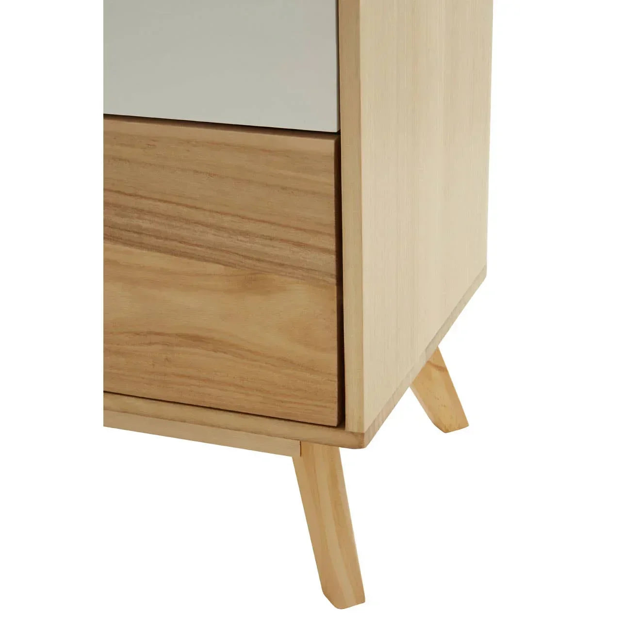 Closeup of wooden chest of drawers with angled legs and light oak finish