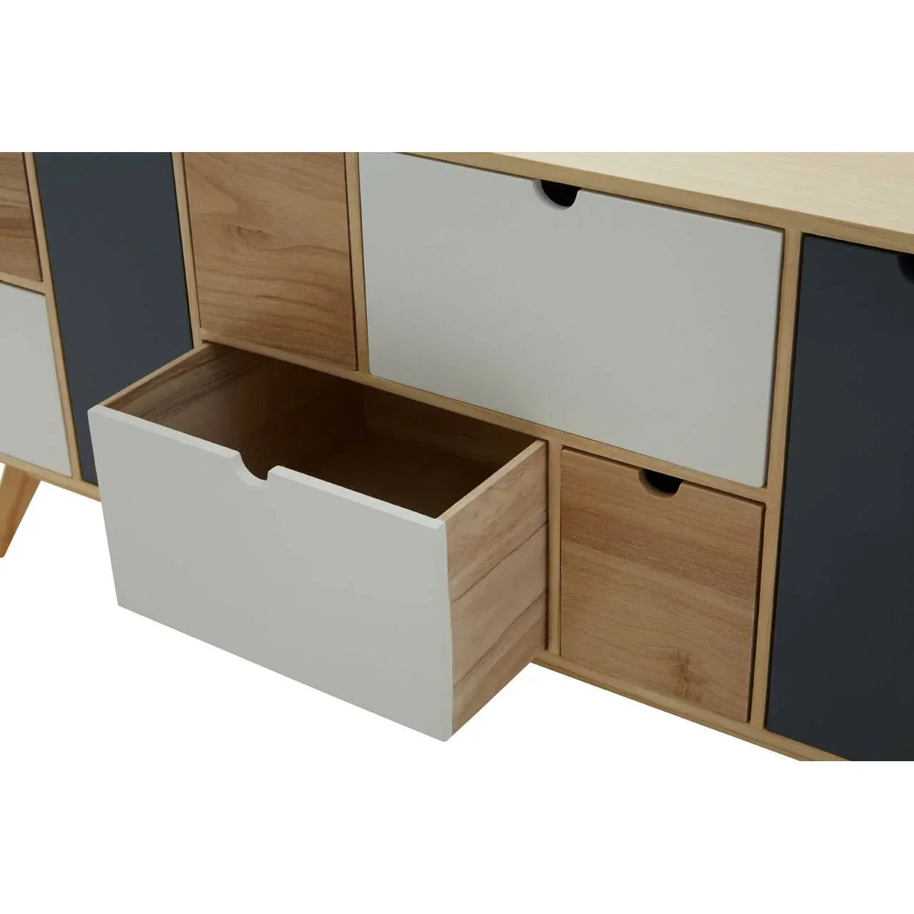 Close-up of wooden sideboard with open white drawer and mixed color panels