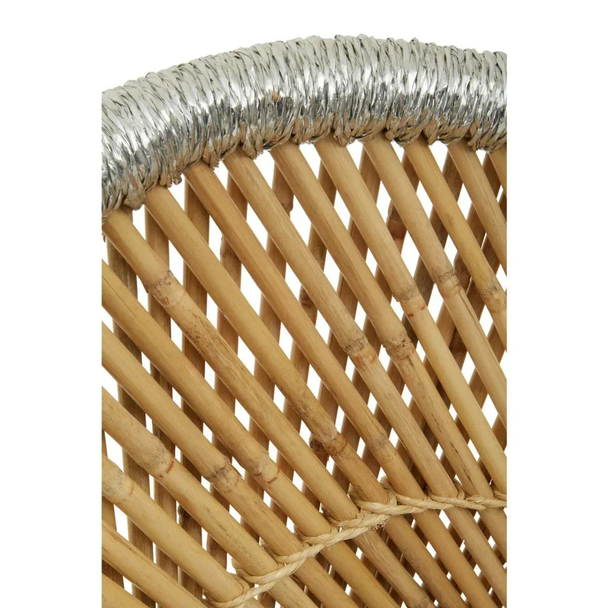 Closeup of rattan chair backrest with natural wood slats and silver trim detail