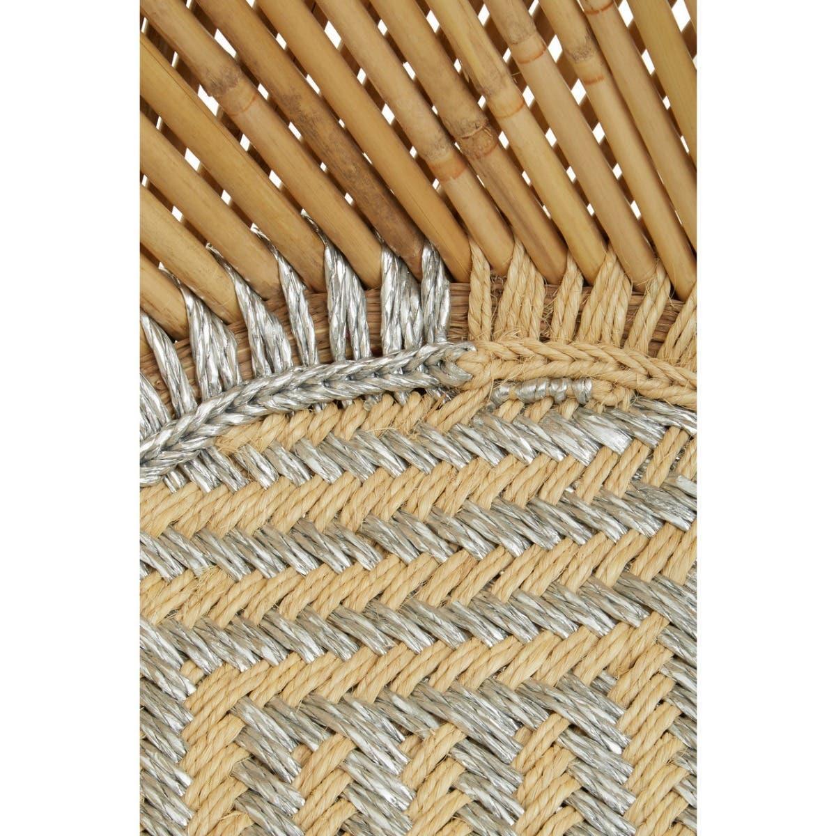 Close-up of woven rattan chair with natural and silver fibers in geometric pattern