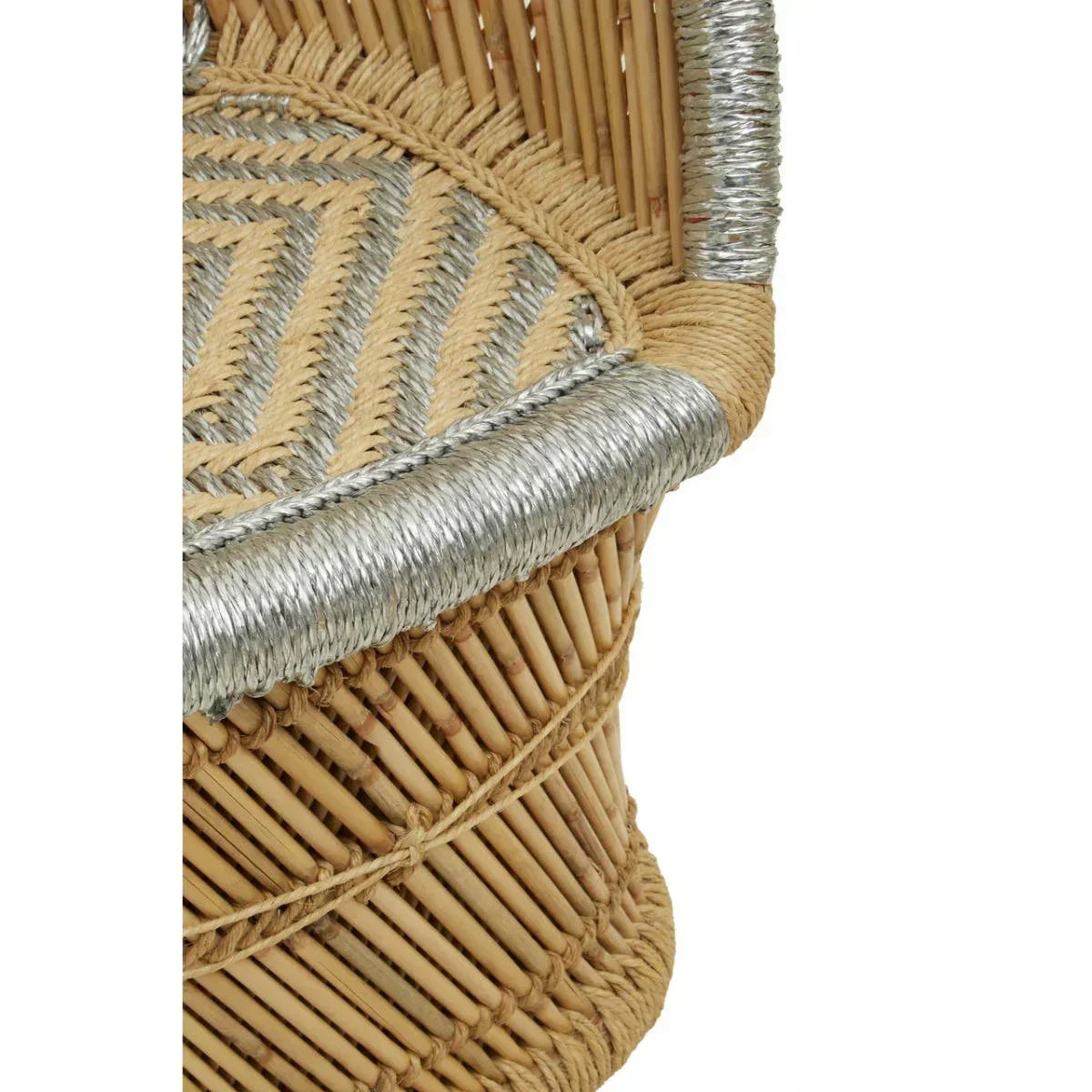 Close-up of rattan chair with woven natural and silver accents on seat and armrest