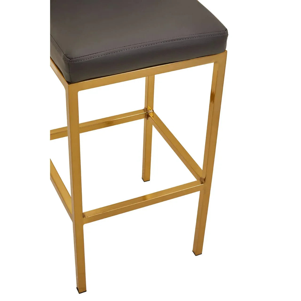 Bar stool with gold metal frame and dark grey cushioned seat close up