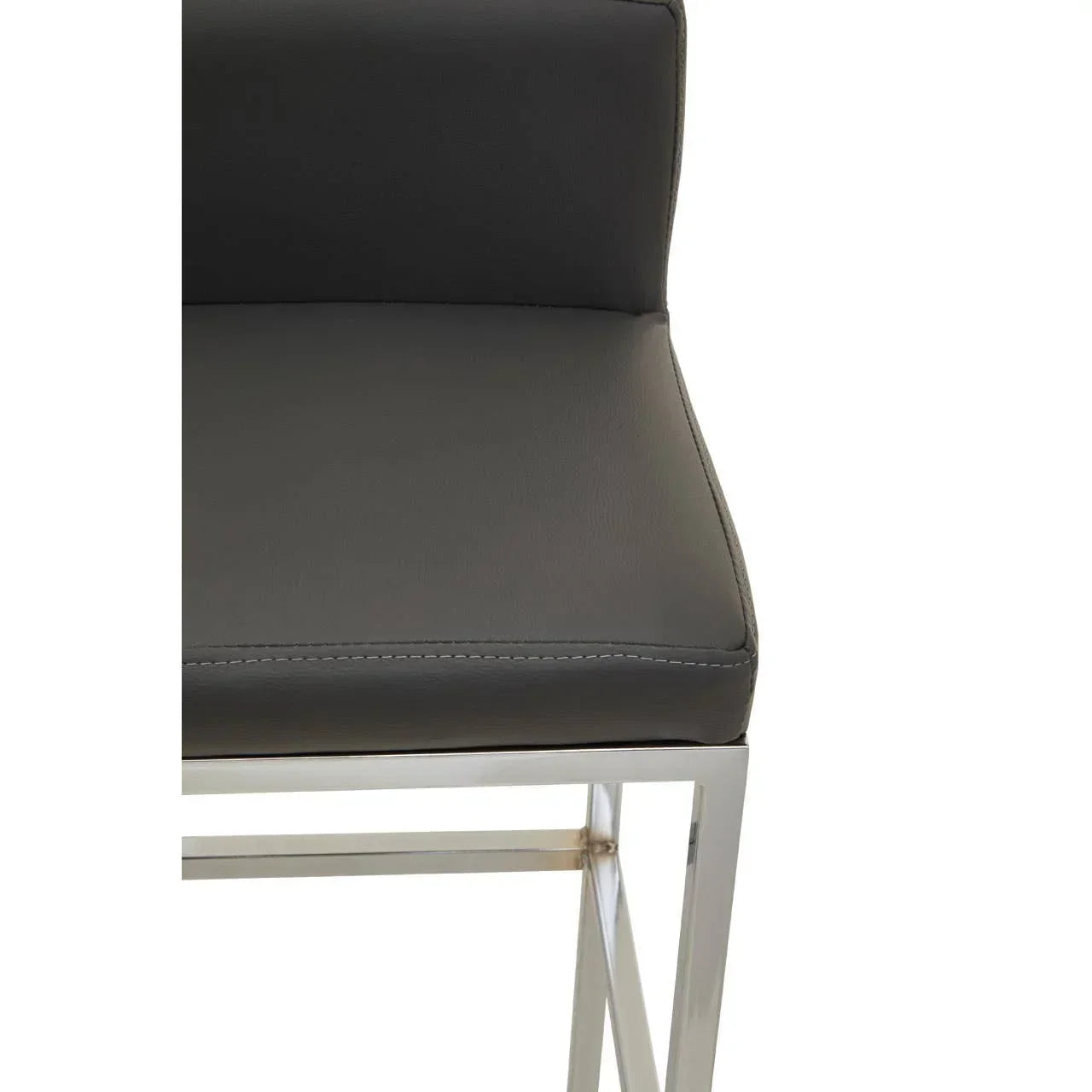 Close-up of dark grey leather dining chair seat with chrome legs