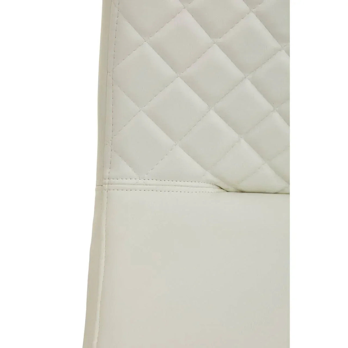 Close-up of white quilted seat and backrest seam with diamond stitching