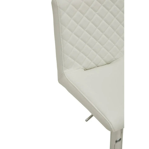 Cream faux leather bar stool with quilted backrest and chrome leg detail close-up