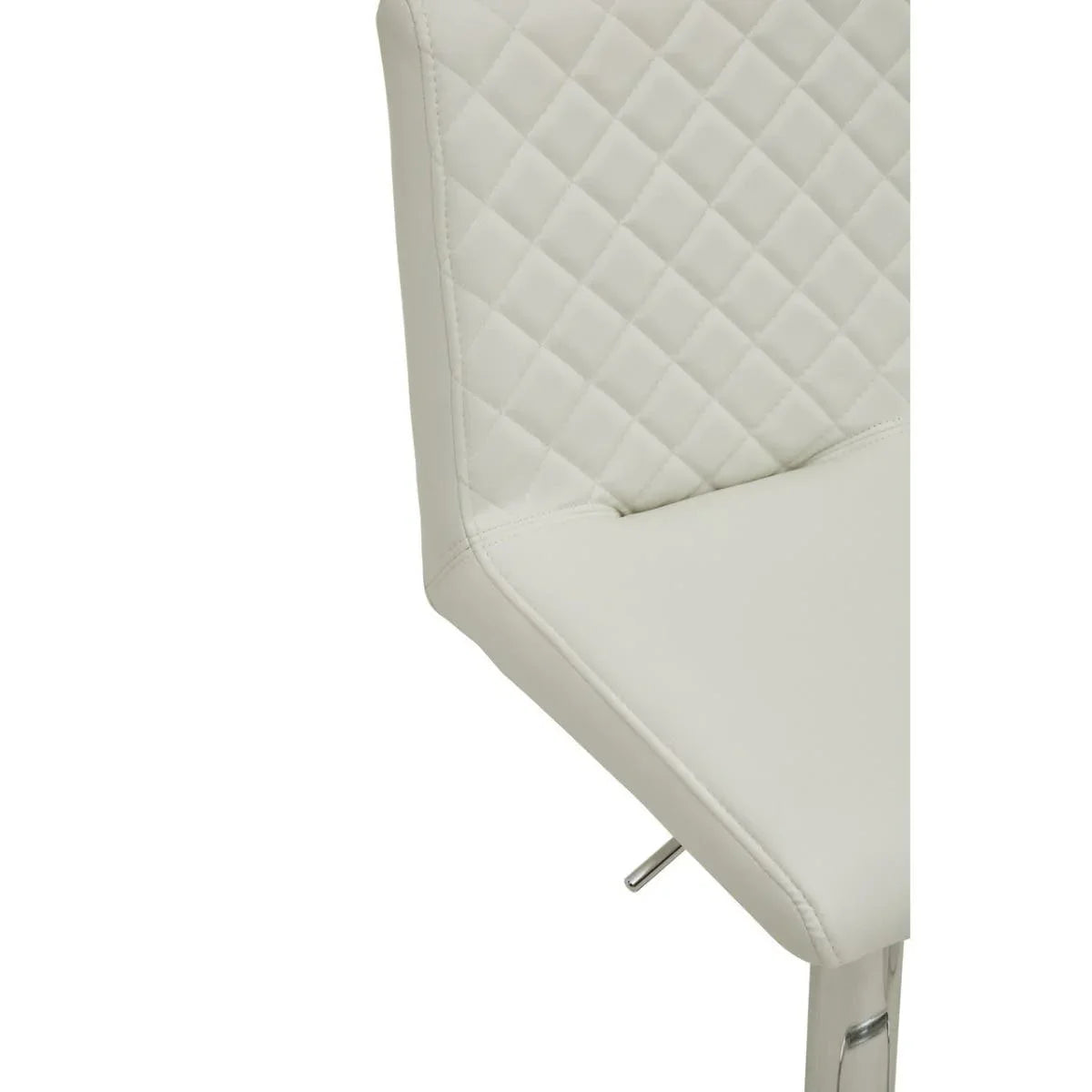 Cream faux leather bar stool with quilted backrest and chrome leg detail close-up