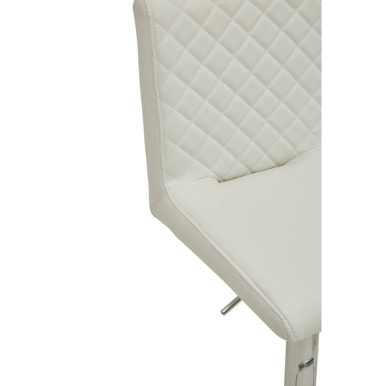 White faux leather dining chair with quilted backrest and chrome legs, close-up view