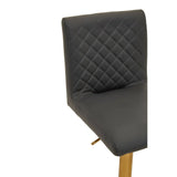 Dark grey bar stool with quilted backrest and gold metal legs, close-up angle