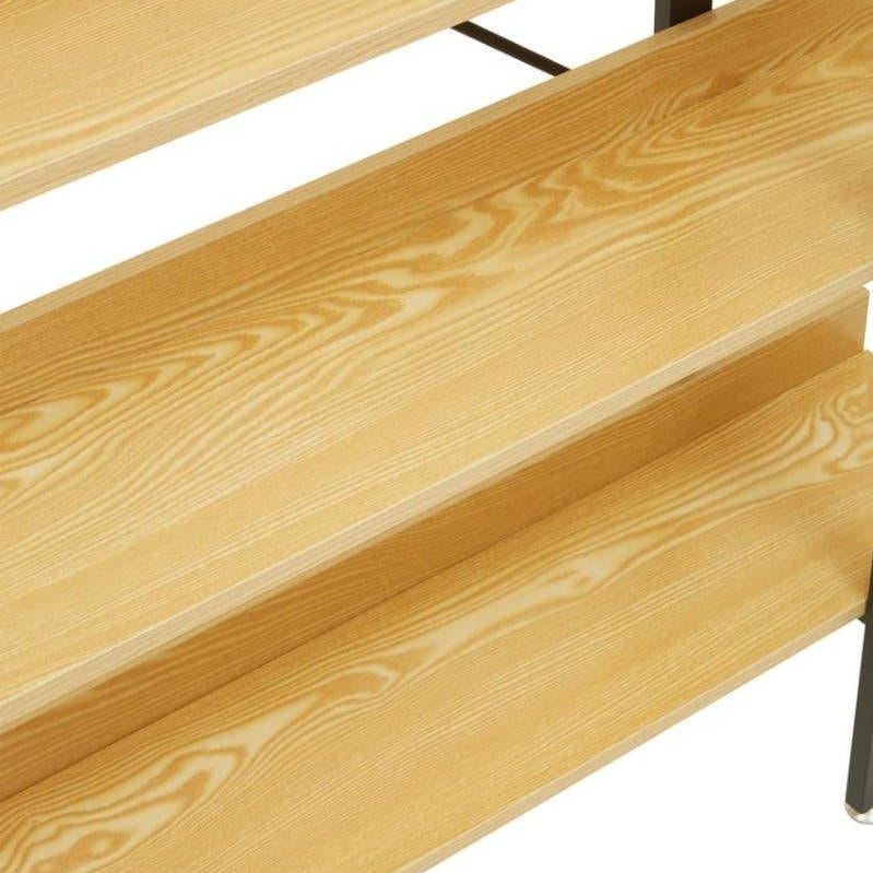 Close view of light wood grain shelving unit with metal supports