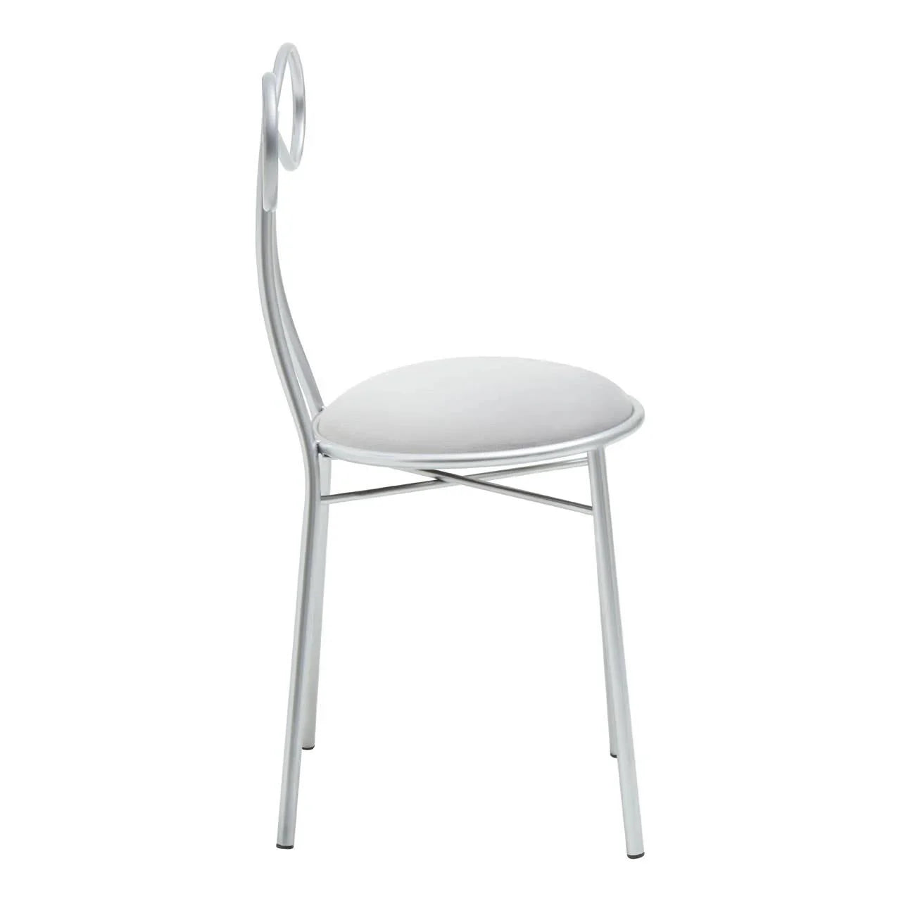 Silver metal dining chair with circular backrest and white padded seat, side view