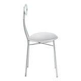 Silver metal dining chair with circular backrest and white padded seat, side view