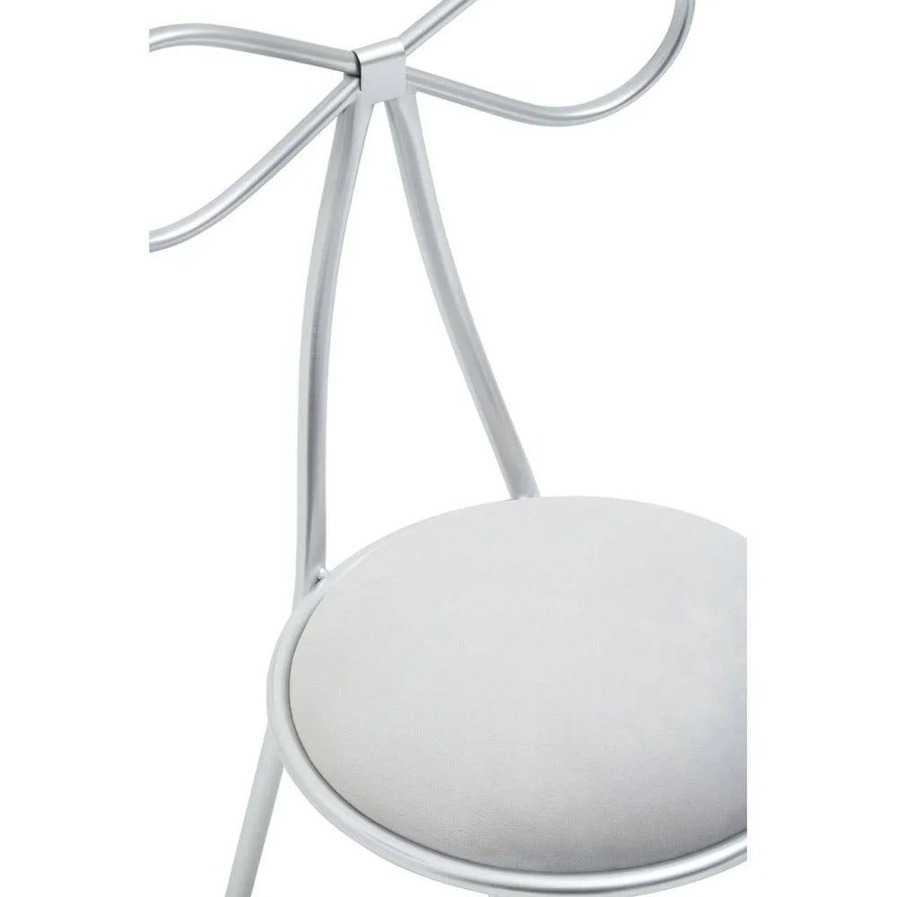 Silver metal dining chair with bow backrest and round upholstered seat