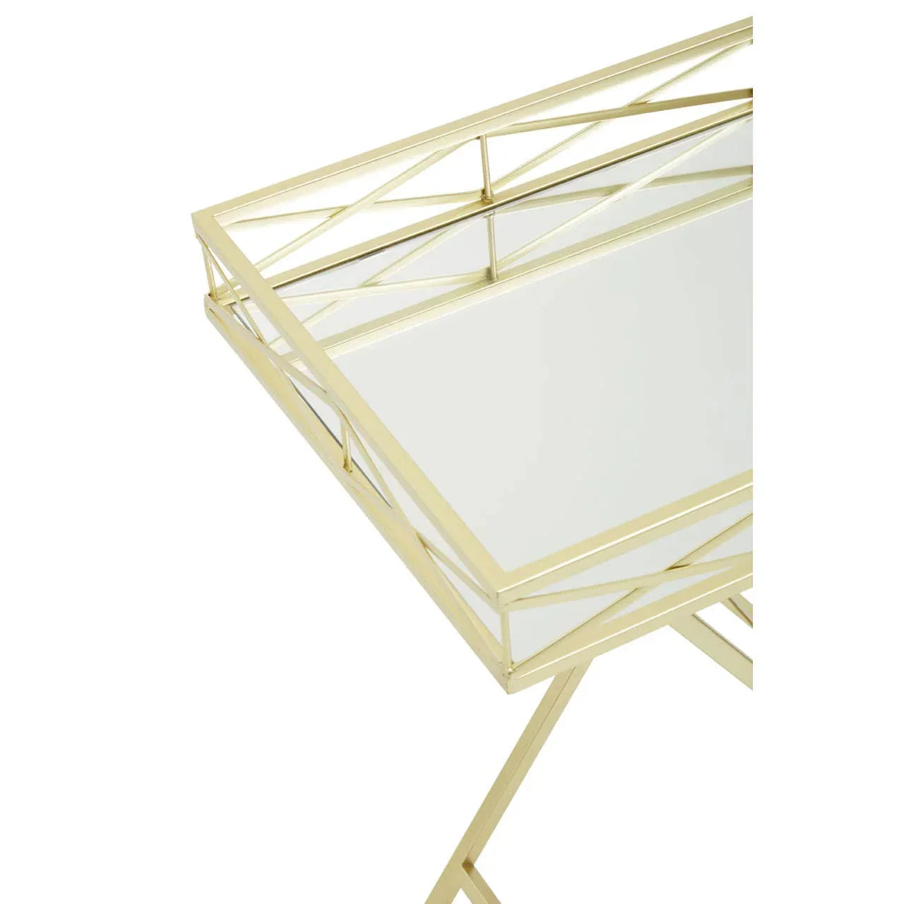 Gold metal side table with glass top and geometric frame detail, close-up angle