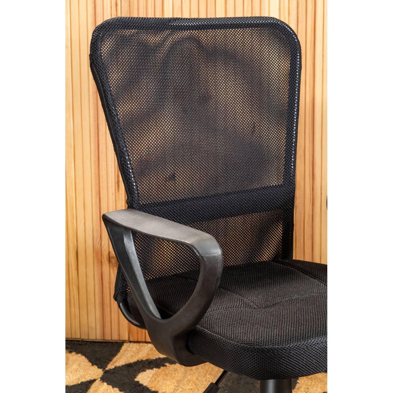 Black mesh office chair with armrests against wood panel wall