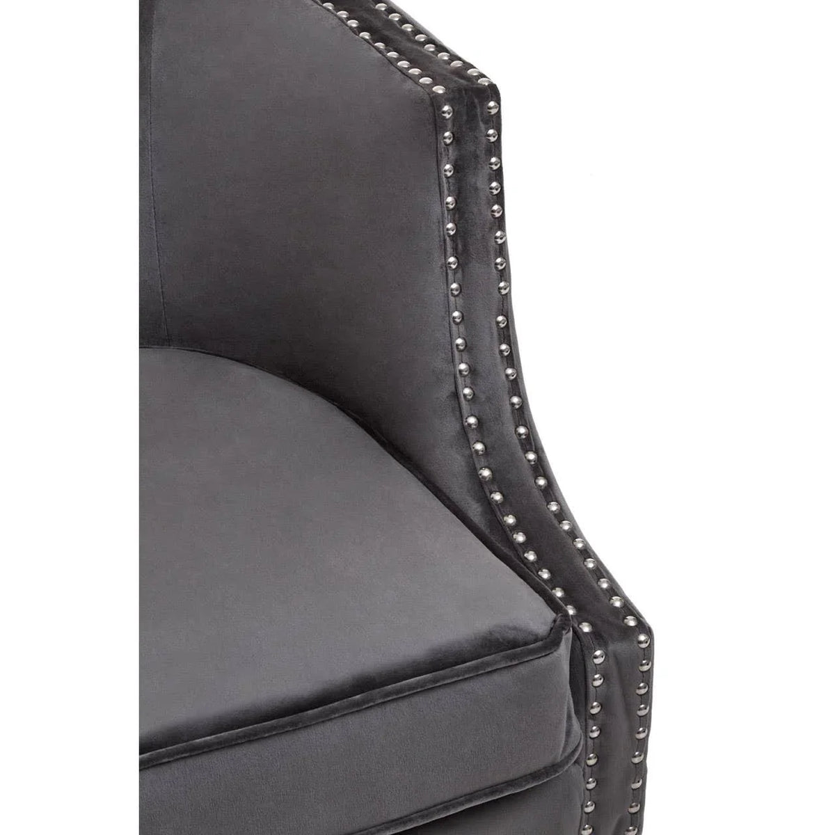 Charcoal velvet armchair with silver stud detailing and plush cushion, close side view