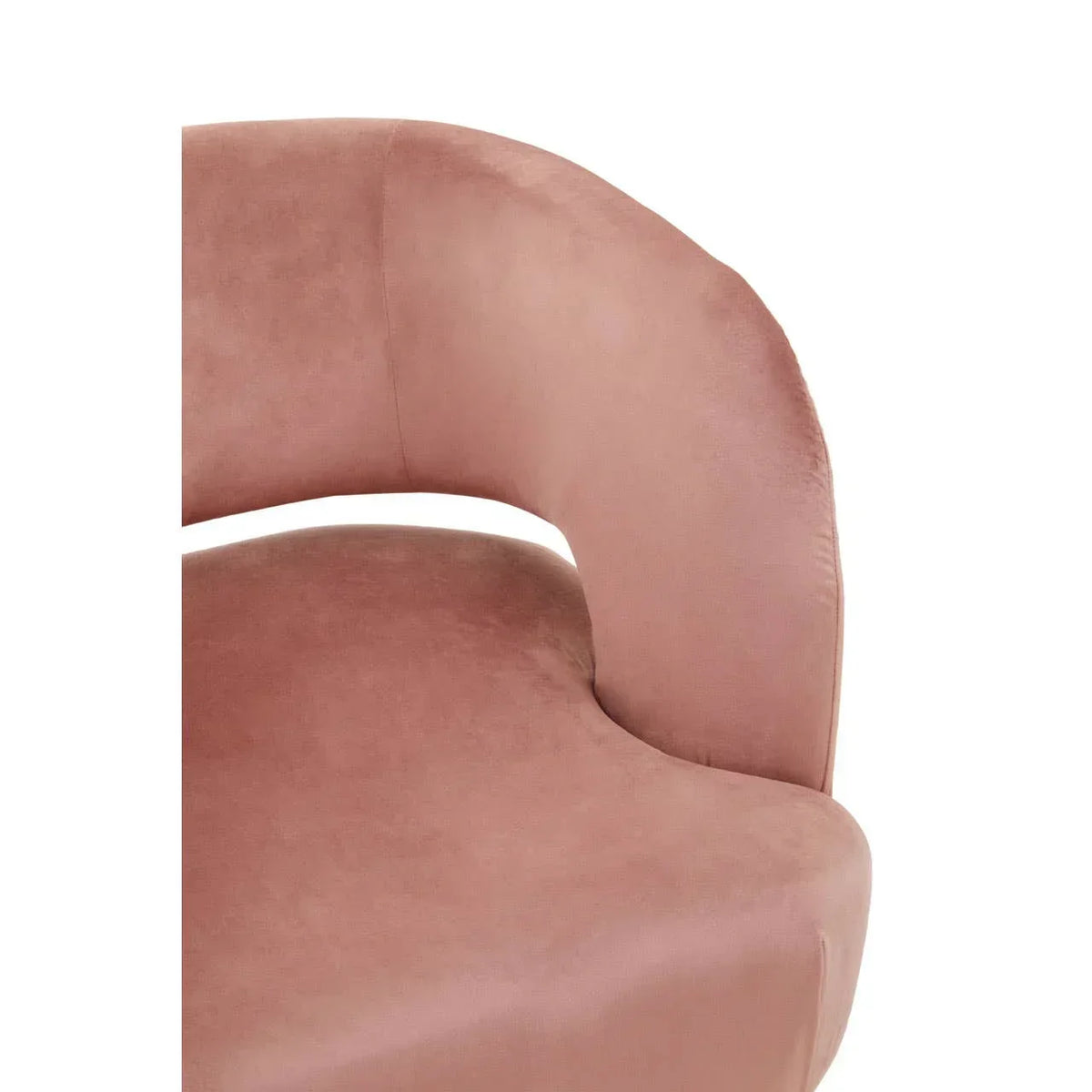 Blush pink velvet armchair seat and curved backrest closeup