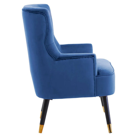 Blue velvet accent chair side view with black legs and gold metal tips