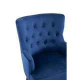 Blue velvet armchair with tufted backrest, close-up of upholstery and button details