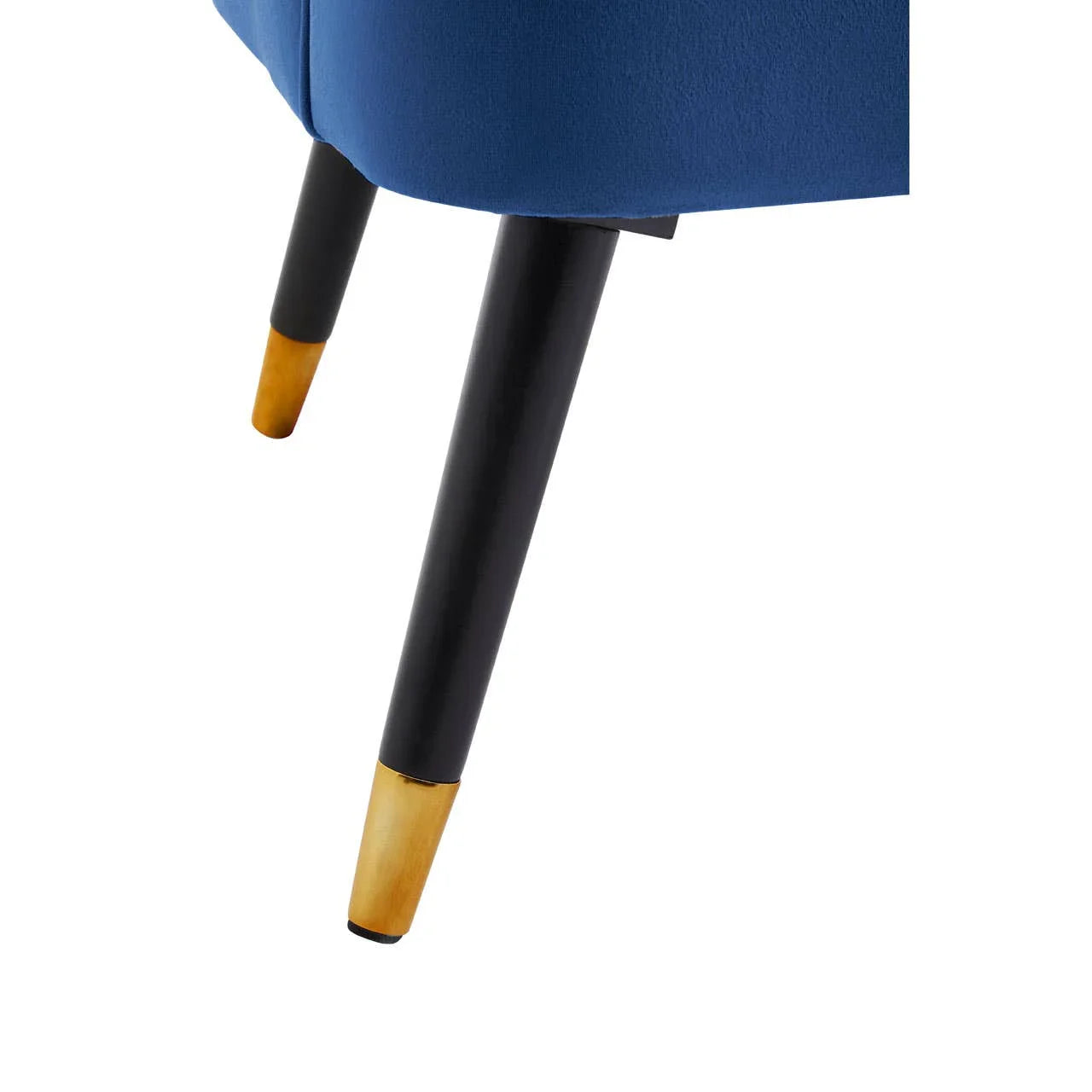 Blue velvet chair with tapered black and gold metal legs, close-up side angle