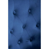 Blue velvet upholstered headboard with deep button tufting close-up