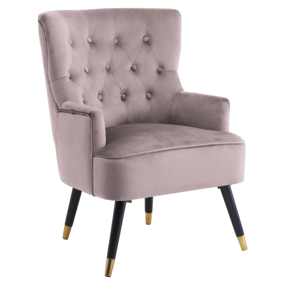 Velvet accent chair with tufted backrest, black legs, and gold-tipped feet