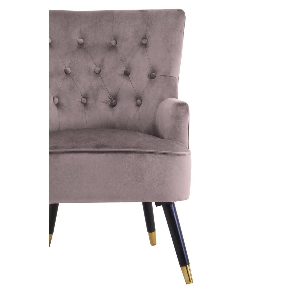 Taupe velvet accent chair with button backrest and tapered black legs with gold tips
