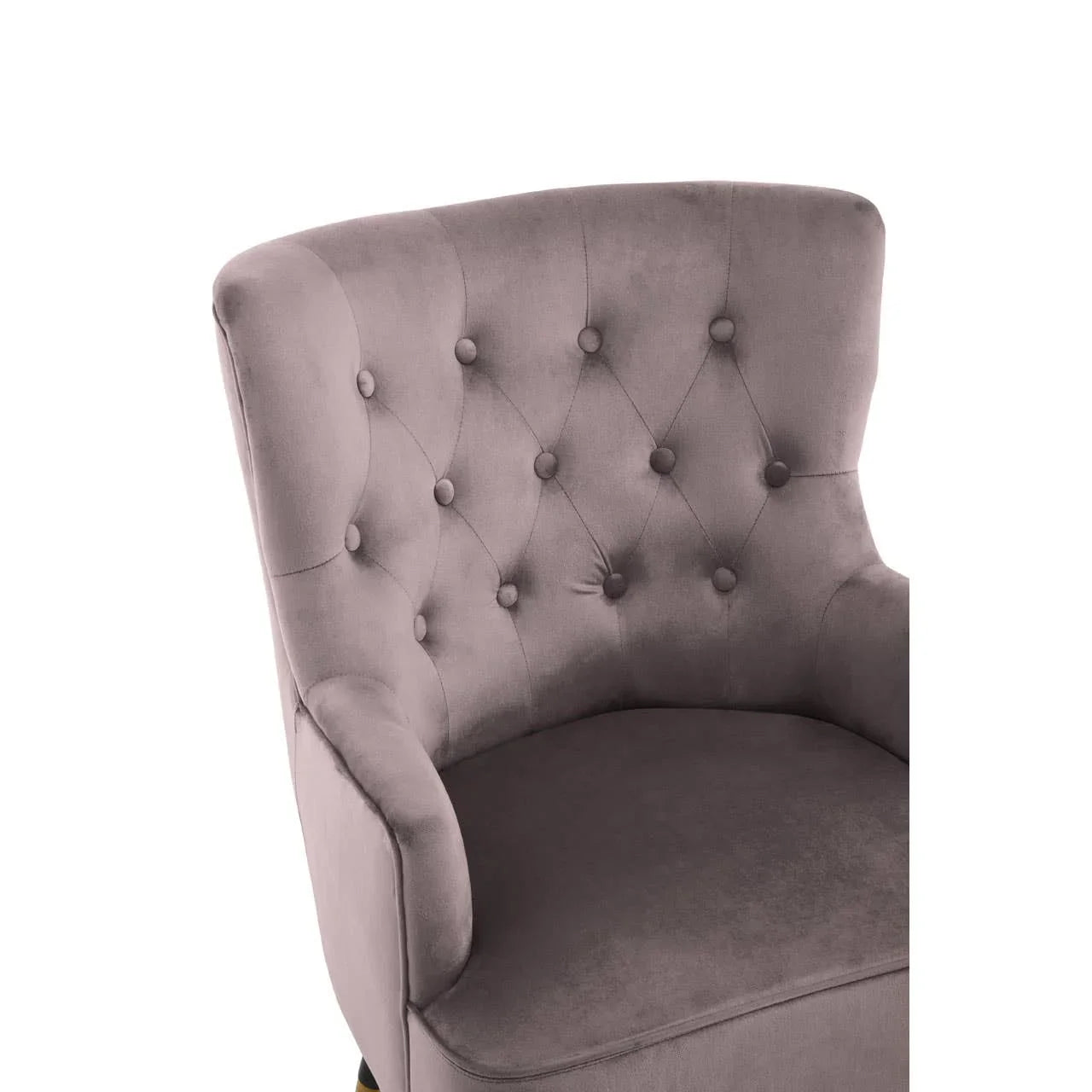 Mauve velvet accent chair with button-tufted backrest and soft curved arms, close-up view