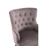 Mauve velvet accent chair with button-tufted backrest and soft curved arms, close-up view
