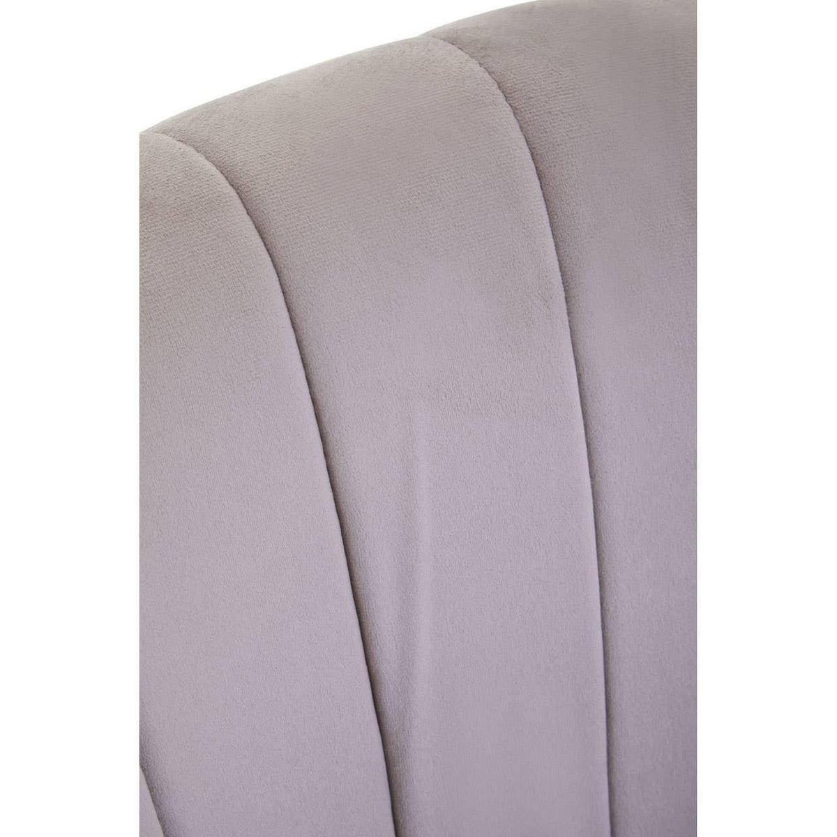 Close up of grey velvet armchair backrest with vertical panel detailing